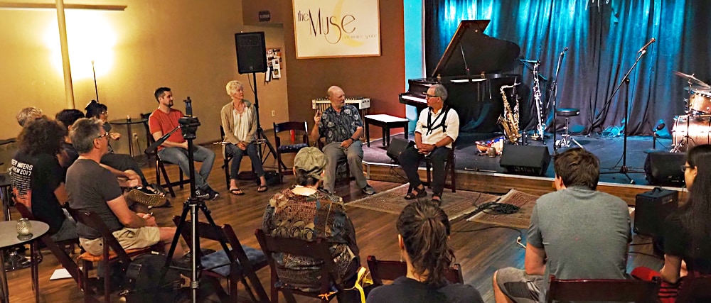 Class in the round discussing an upcoming exercise.